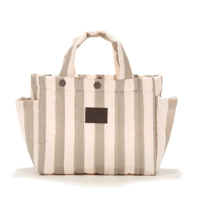 Handla nu La Millou barnvagnsförvaring quiltade ränder beige